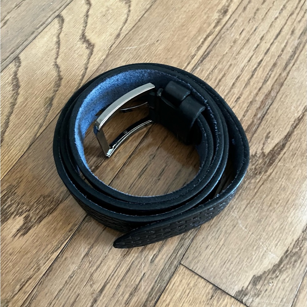 NWOT black leather belt with silver-tone hardware 50” long